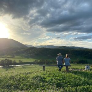 Couple looking over the Rocky River valley from a bench at Wunglebung Campground