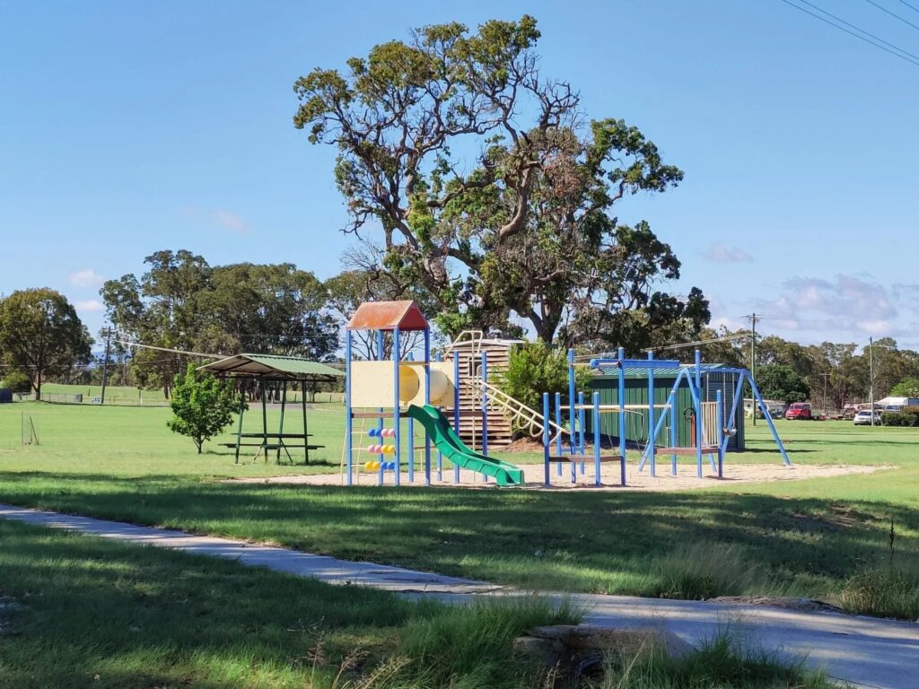 Colourful playground under shade trees at Jennings Park